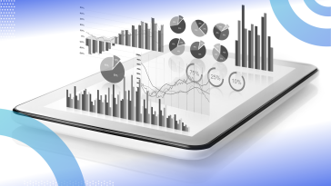 Data visualization conceptual image of a tablet with 3D graphs and charts hovering above it