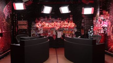 tastylive studio set with two commentator tables facing each other with lights overhead