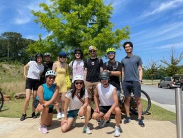 A group of employees getting ready to go on a bike tour