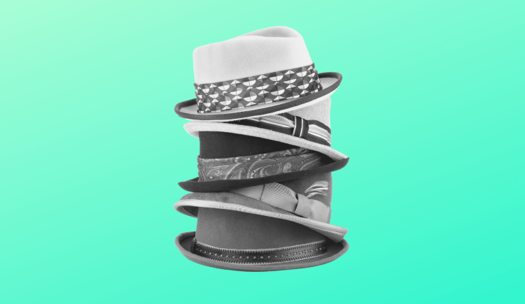A stack of different hats, marketing generalist