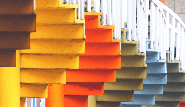 Multi-colored stairways offering different paths and perspectives to the top.