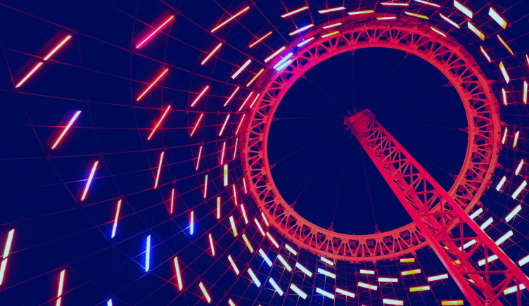 Lights rotating towards the top of a tower after making a full cycle.