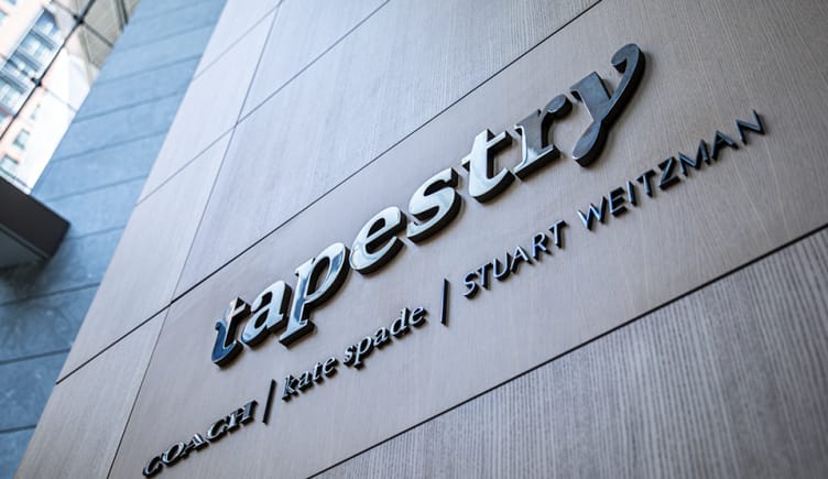 Tapestry logo on outside of office building