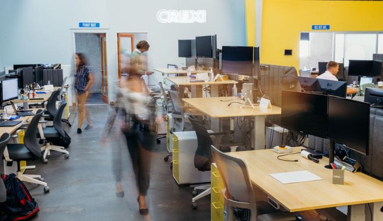 Crexi office with motion blurred team members