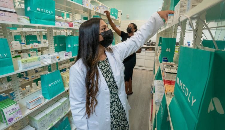 Medly pharmacist working in pharmacy