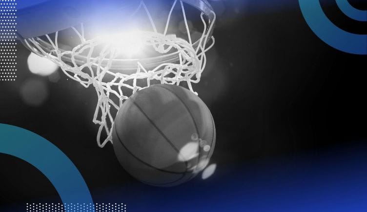 A basketball falls through the hoop