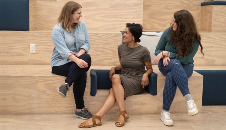 Yotpo team members having a chat in the office