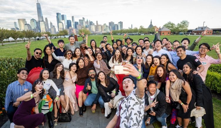 Braze team members taking a group selfie with the Chicago skyline in the background