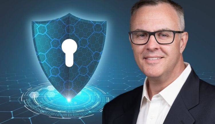 Cybrary CEO Kevin Hanes on a blue background with a lock symbol.