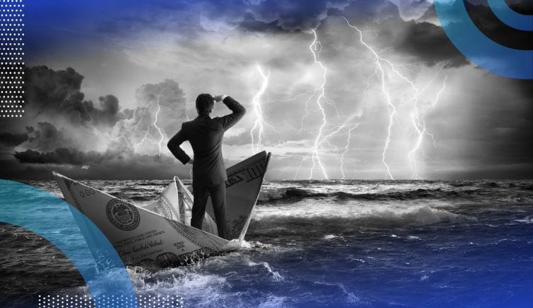 A man stands in a boat made of a folded dollar on the sea facing a coming storm