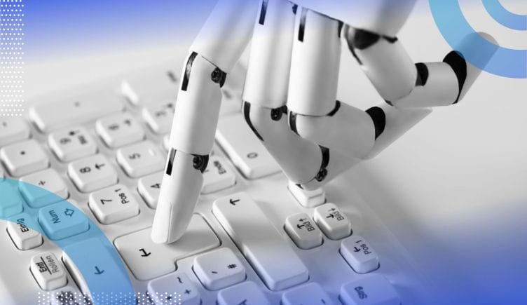 An articulated robot hand presses a return key on a keyboard with one finger. /robotics/software-revolution-robotics