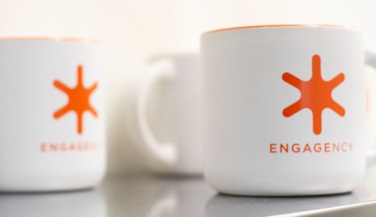 Mugs with the Engagency logo on them