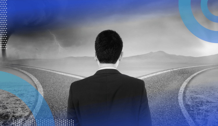 A man in a suit is facing away, looking at a road that splits in two, one headed toward a storm and tornado and one headed toward sunshine. /recruiting/8-questions-to-ask-before-joining-doomed-startup