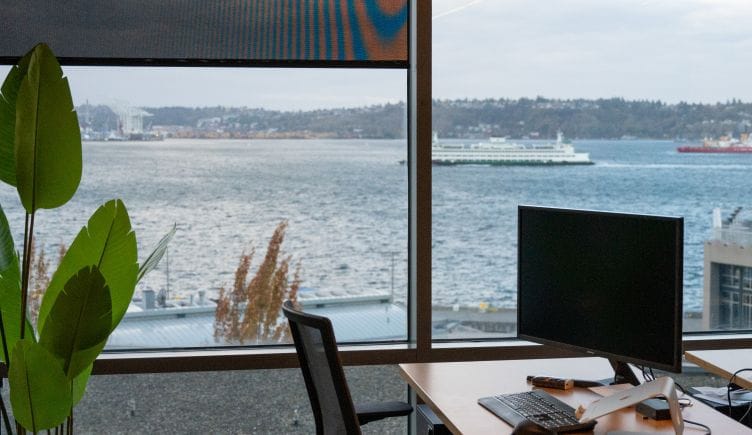 A desk in the TaxBit office looks out at the water in Seattle.