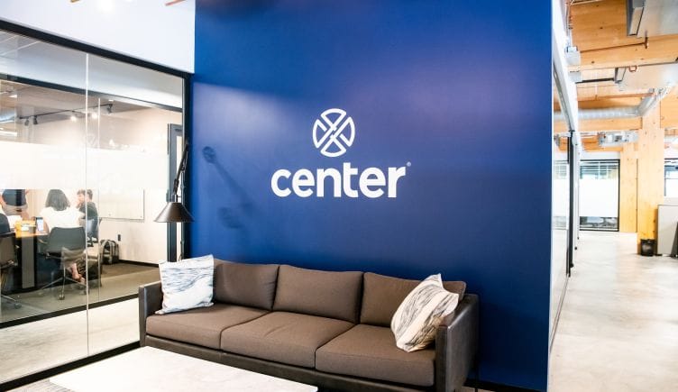 The Center logo on display in the entry to the company's offices