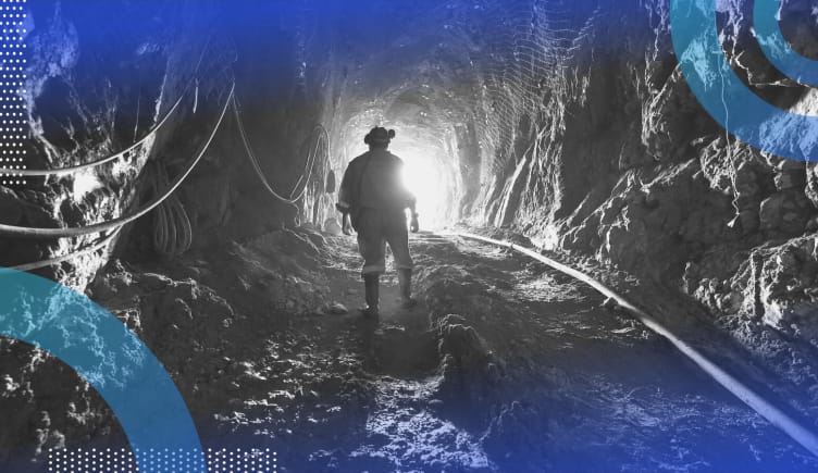 Data mining image of a miner walking down a shaft toward daylight