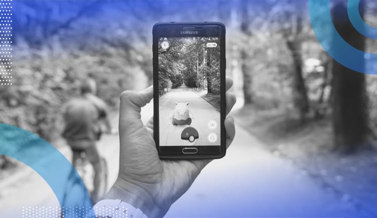 Augmented reality (AR) image of a person playing Pokemon Go, an AR game, on a bike path. 