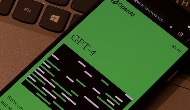 A phone displays OpenAI's GPT-4 announcement.