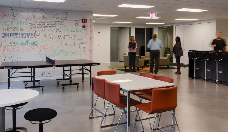 Photo of Litera’s office, with a whiteboard wall, ping pong table and eating area