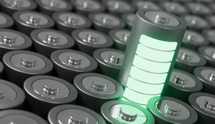 A battery contains glowing green energy bars to represent energy storage.