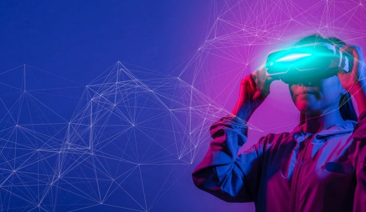 person wearing virtual reality headset in blue and purple lighting