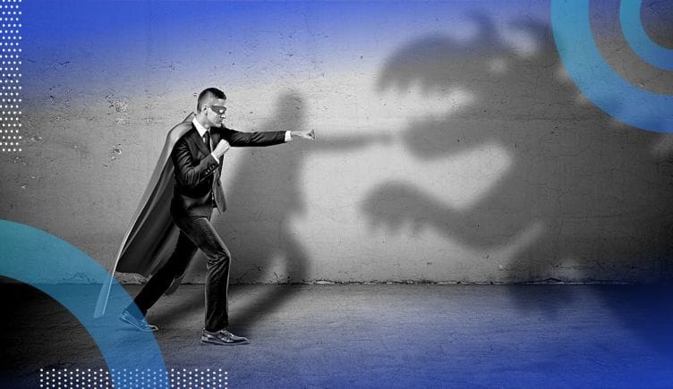 A business man fighting the shadow of a dragon or dinosaur.