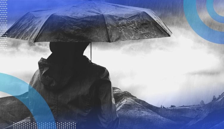A person in a storm. CEOs and CHROs can navigate uncertainty with a little bit of planning.