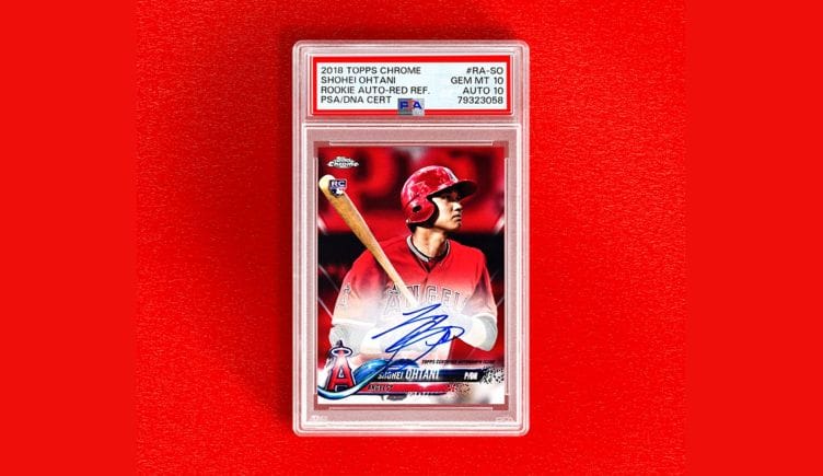 Photo of collectable baseball card featuring Shohei Ohtani, autographed, on a red background.