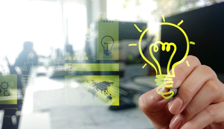 Innovation concept: hand drawing light bulb with office interior background.