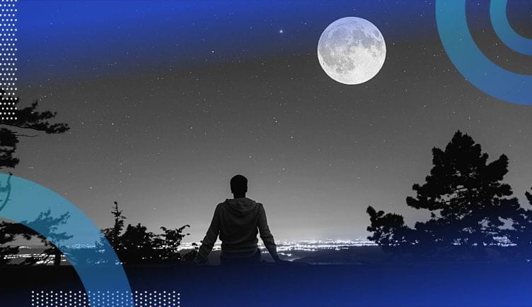 A person sitting in moonlight. Moonlighting helps employees make extra money and fulfill their dreams. 