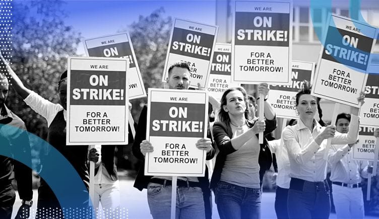 Workers on strike. Labor strikes will continue unless employers pay people more and treat them like humans.