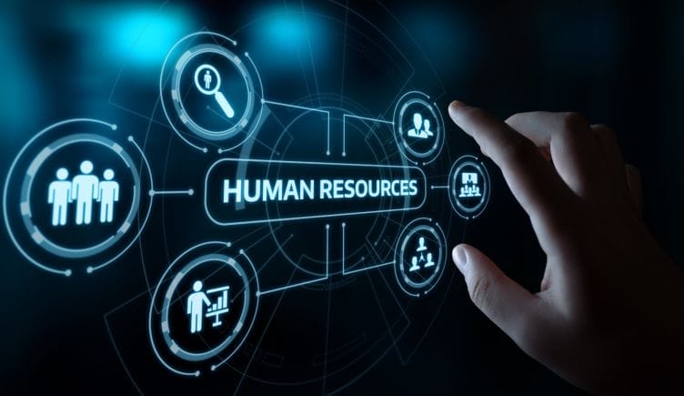 A hand touching a screen that reads 'Human Resources'