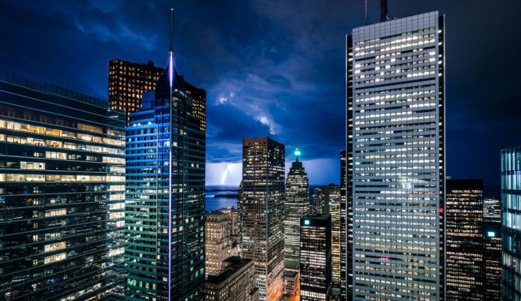 The Toronto skyline is pictured at night.