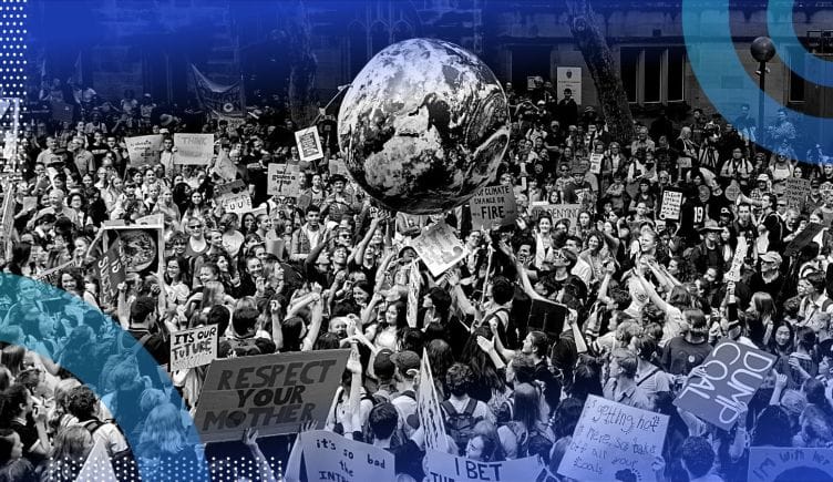 An environmental rally with a huge globe in the middle