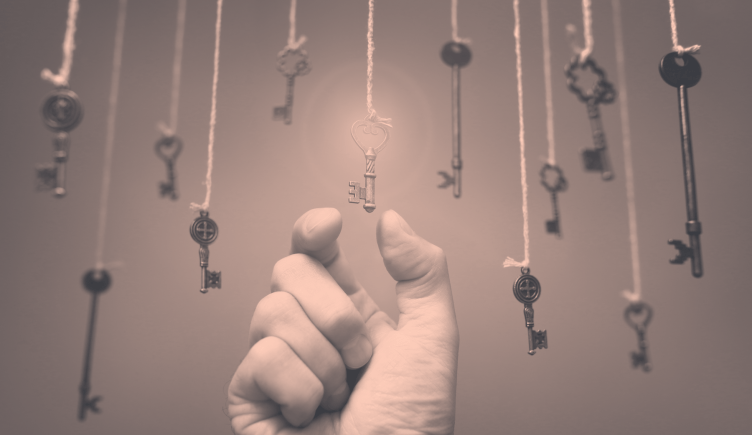 Hand reaching for a hanging key.