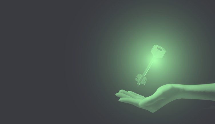Outstretched hand under a floating key that is lit up.