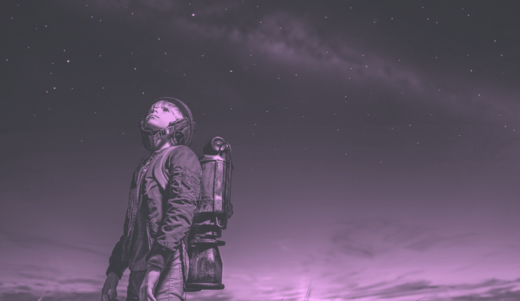 A young boy in a jetpack looks at the sky and wonders what the future will hold