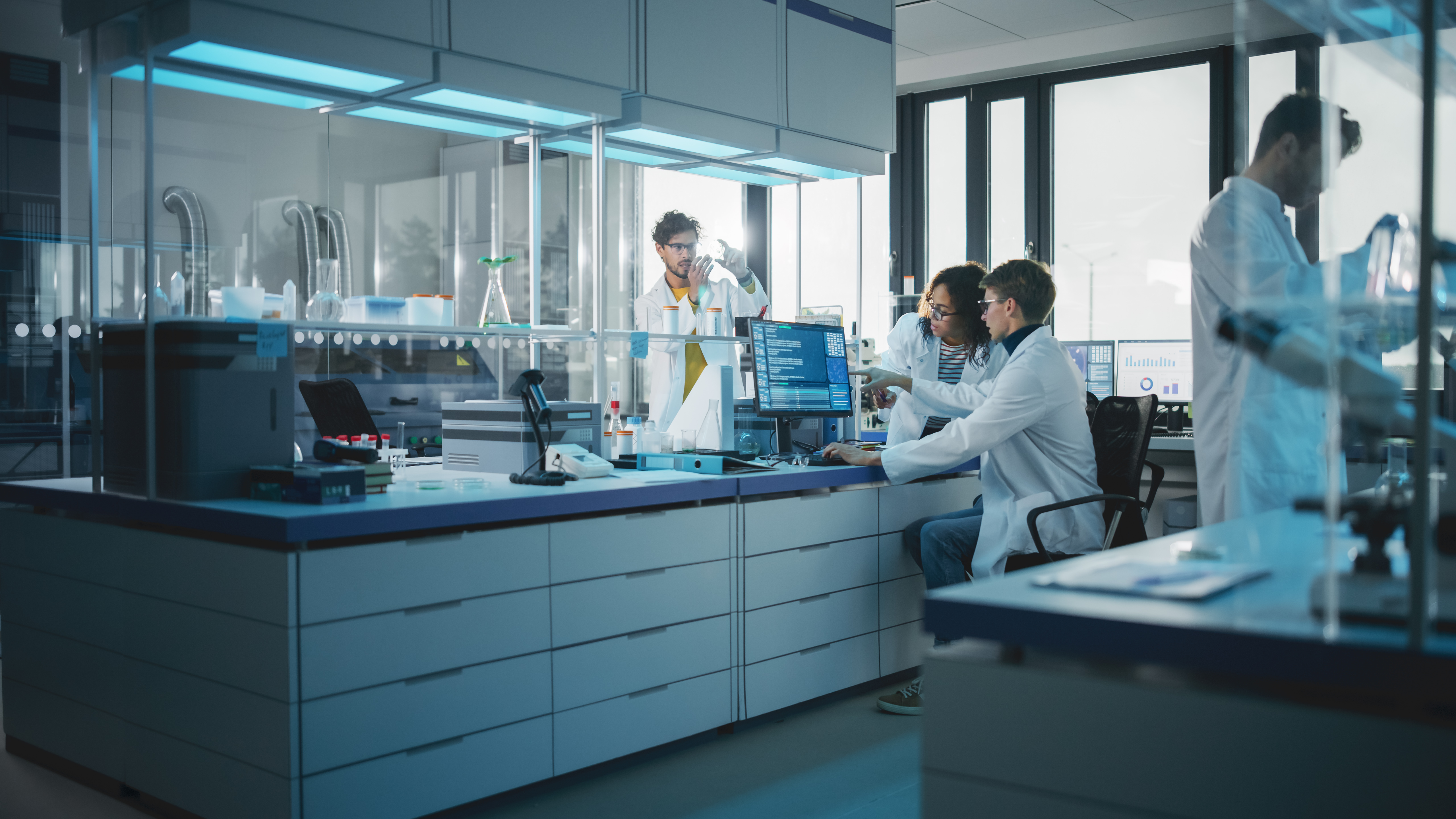 A team of medical researchers works in a lab setting