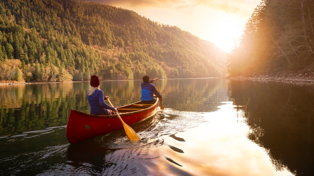 Two people paddling a canoe