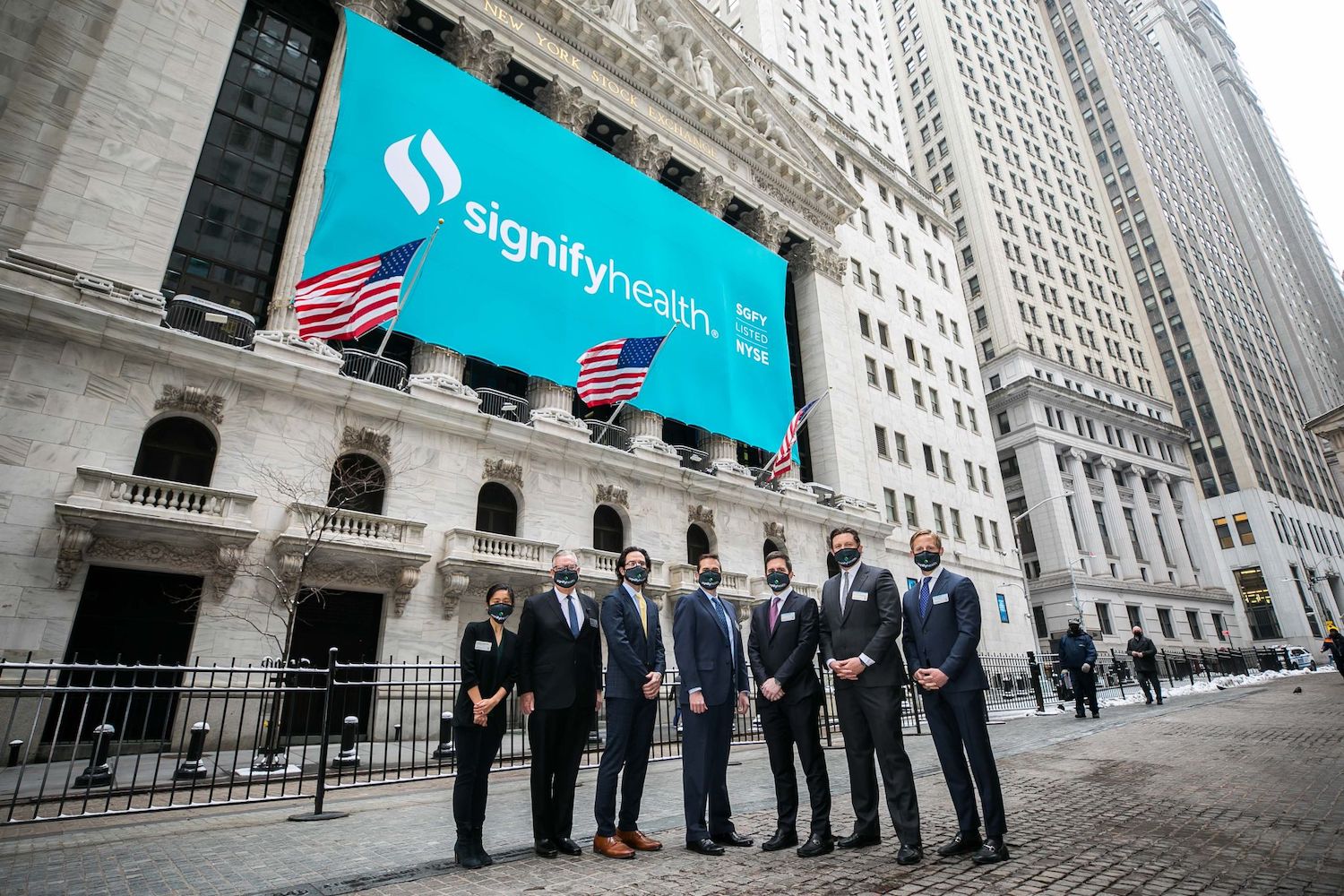 Signify Health’s leadership team stands outside of the New York Stock Exchange. | Photo: Signify Health / LinkedIn