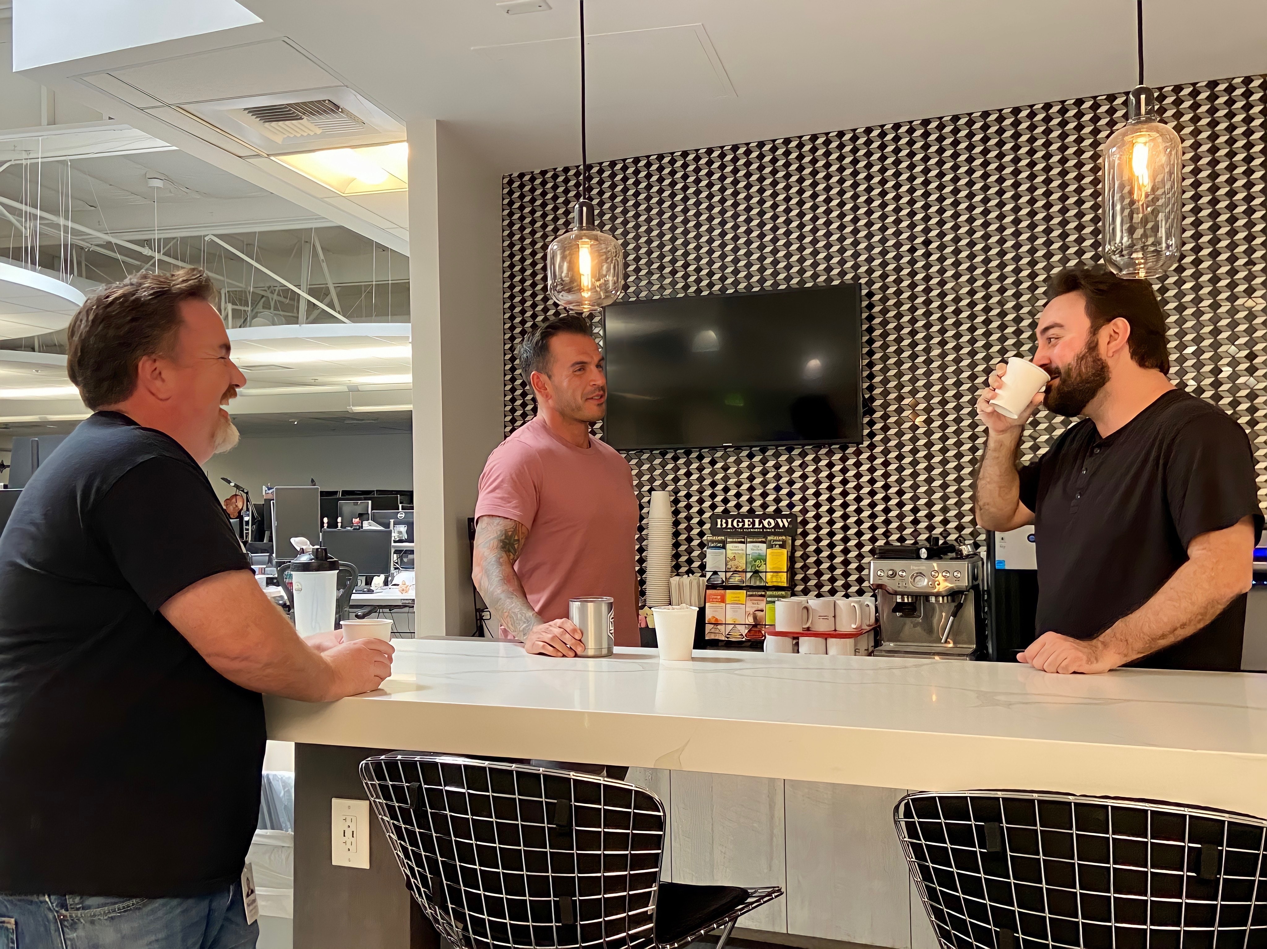 Pennymac team members in the office kitchen