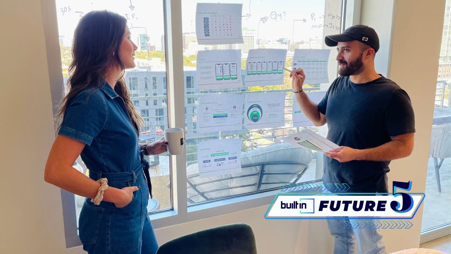 Hangtight co-founders Kate Grehl and Armando Vera Carvajal review plans for their app.