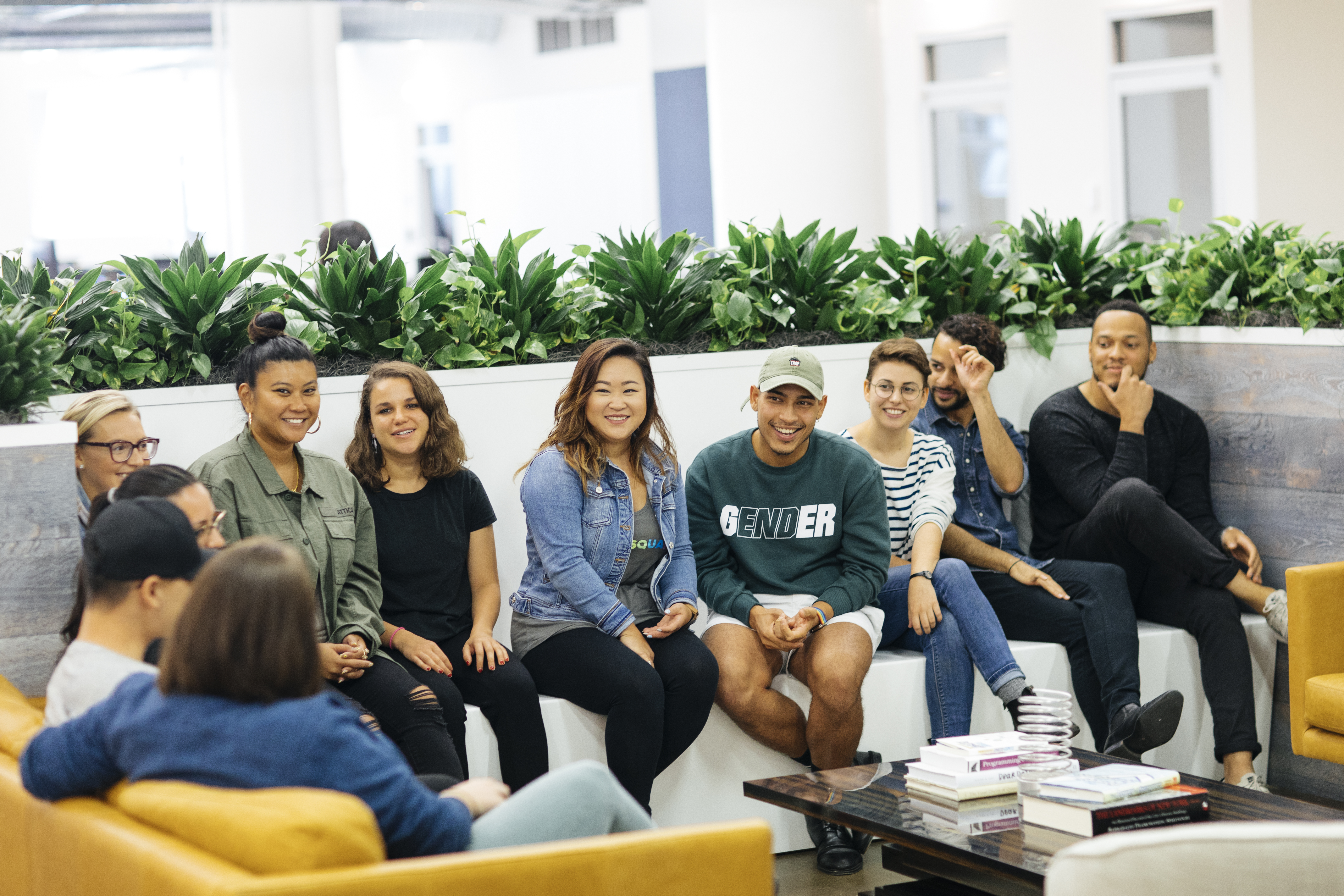 Photo of Foursquare employees gathered on a couch.
