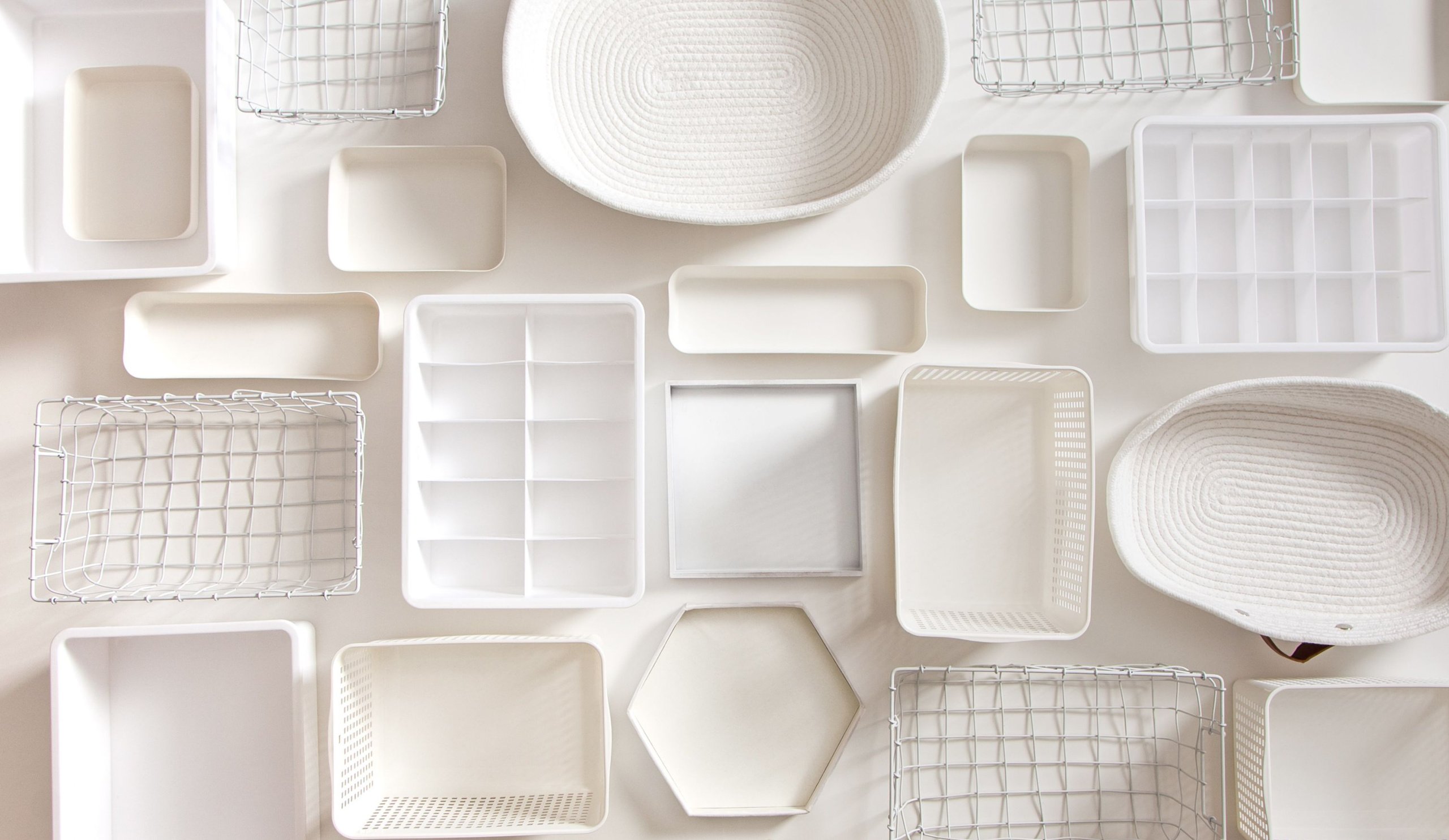 A flat lay photo of clean white storage objects
