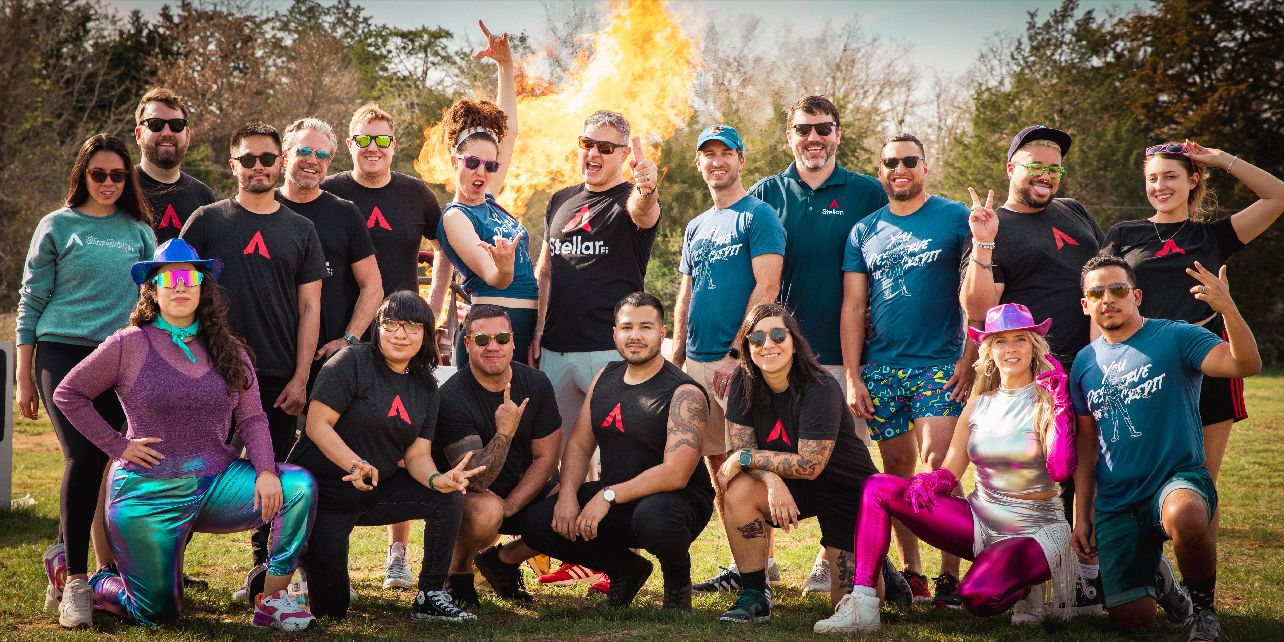 StellarFi’s staff pose for a group photo outside.