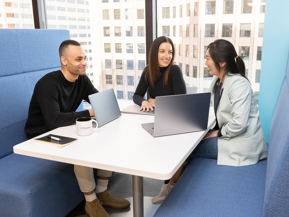 coworkers talking at a table