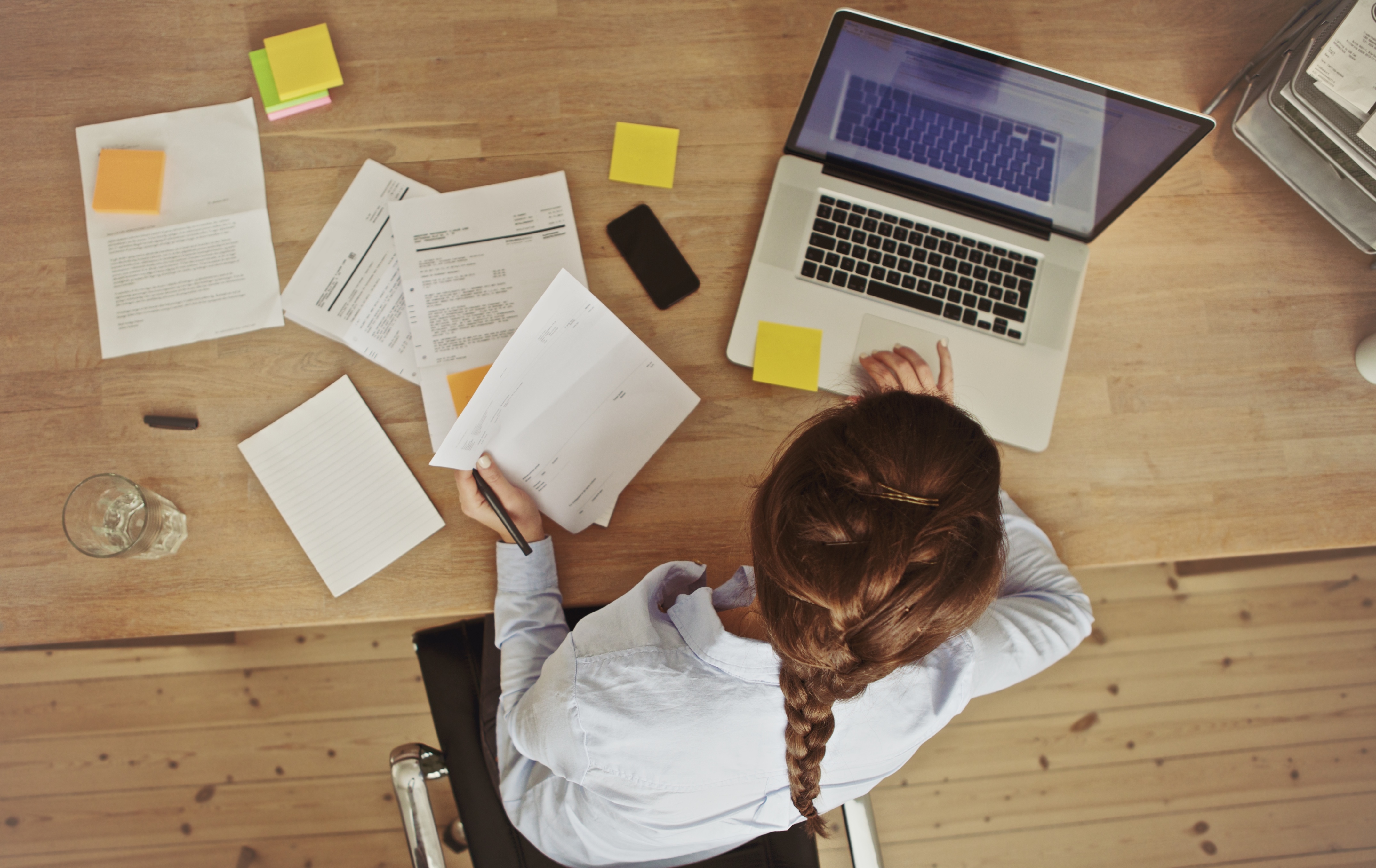 woman at laptop with papers