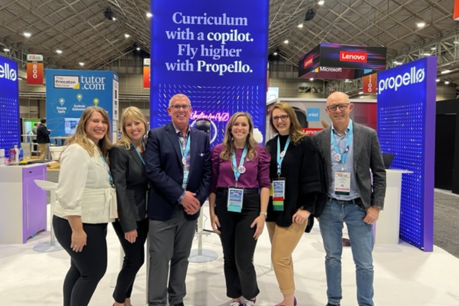 Members of the Propello team pose for a group photo at a convention.