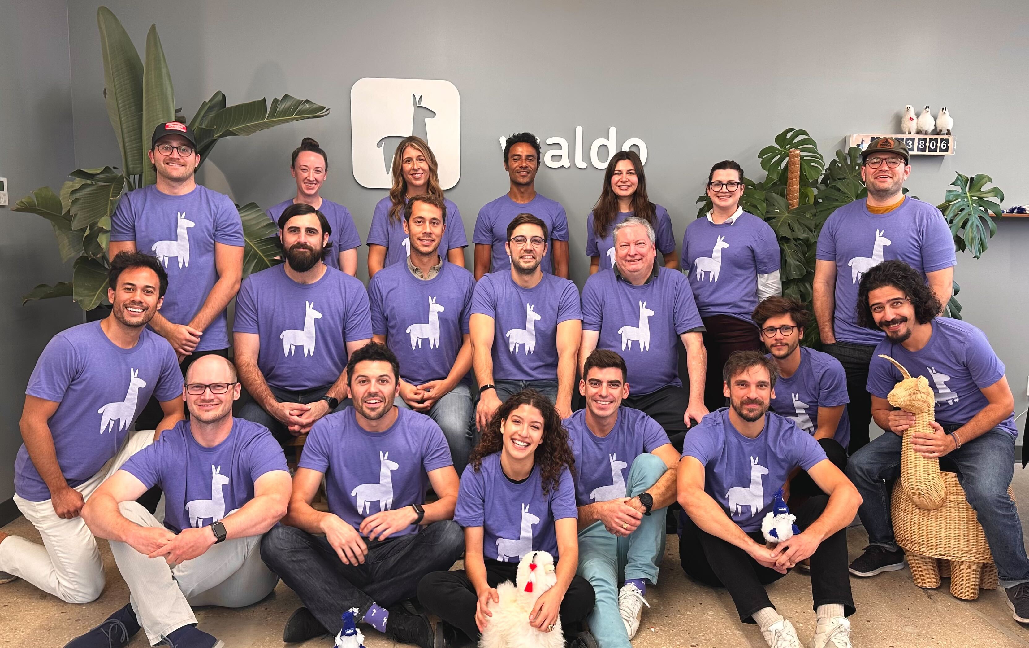 Waldo team photo, all in purple llama shirts.
