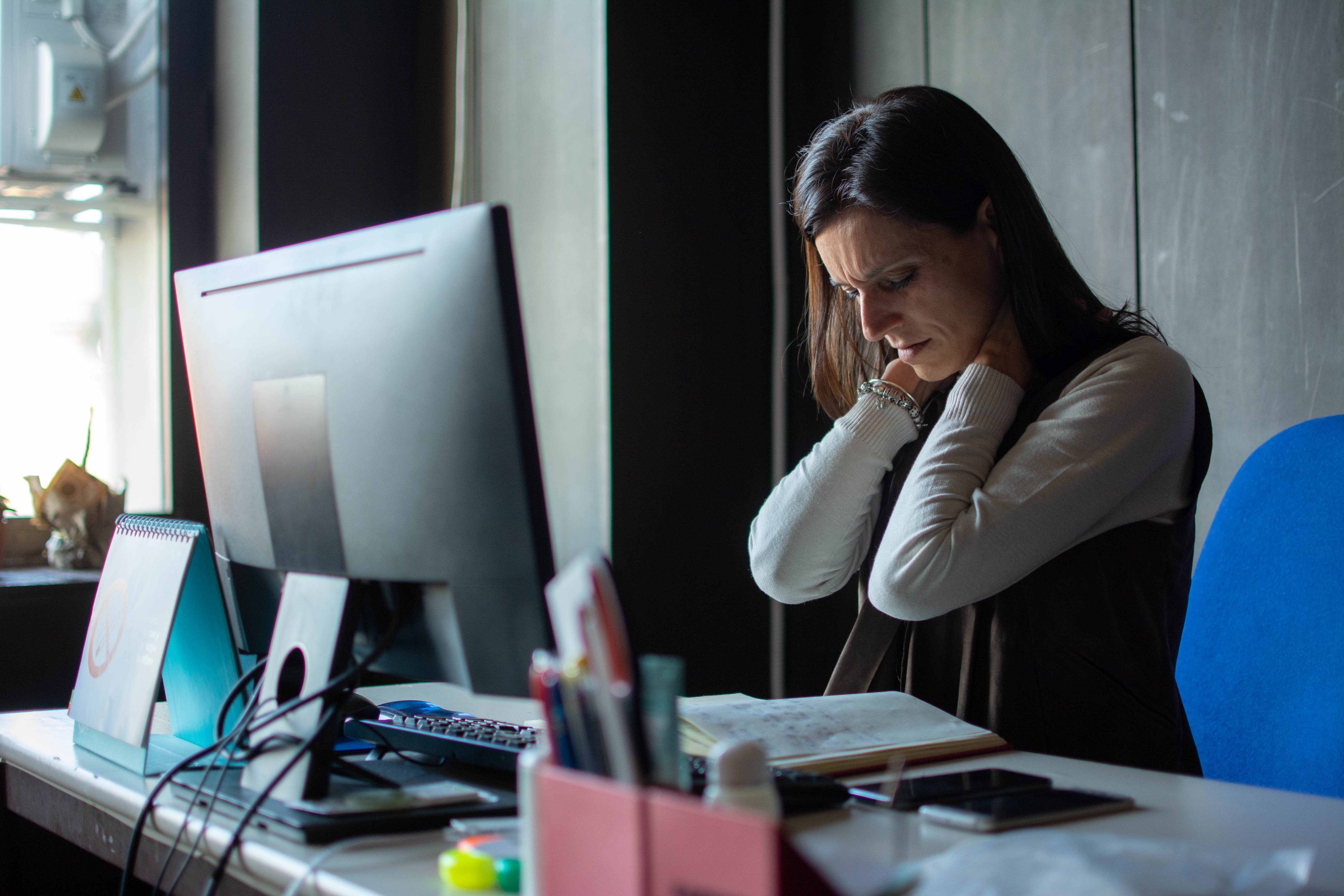 Fatigued woman at computer